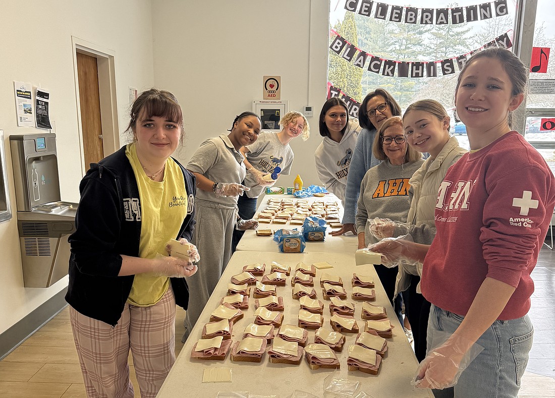 Holy Names students volunteer at the Interfaith Partnership for the Homeless as part of the school's service day on March 5. (Provided photo)