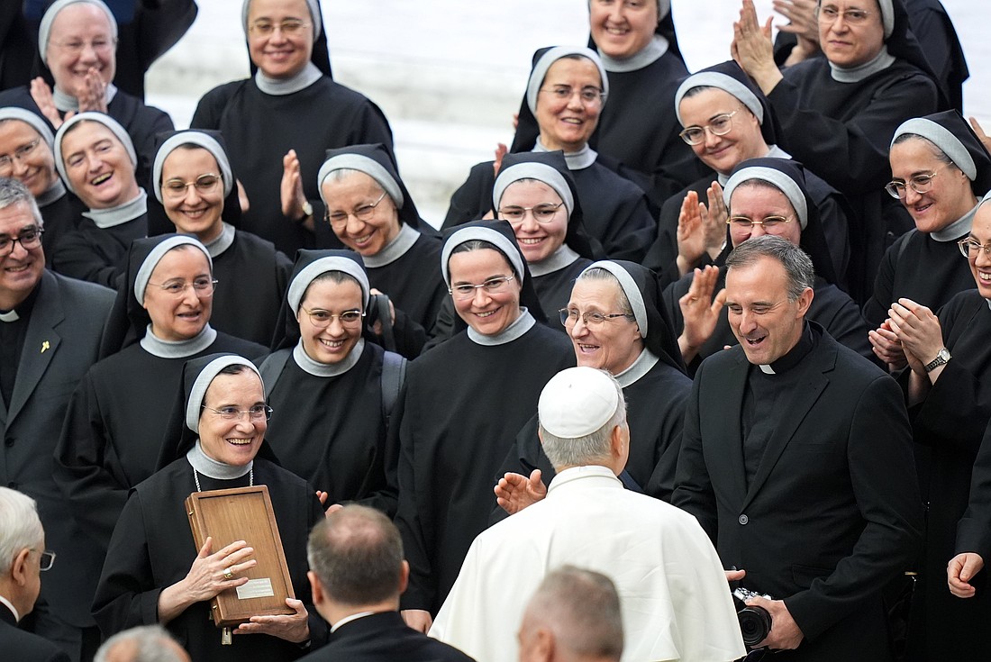 Pope Leo XIV greets a group of religious sisters and priests in the Paul VI Audience Hall at the conclusion of his weekly general audience at the Vatican Aug. 20, 2025. In his first message for the World Day of Prayer for Vocations, Pope Leo said March 25, 2026, that in discerning one's vocation, it is essential to cultivate trust in the Lord. The vocations day is April 26. (CNS photo/Lola Gomez)