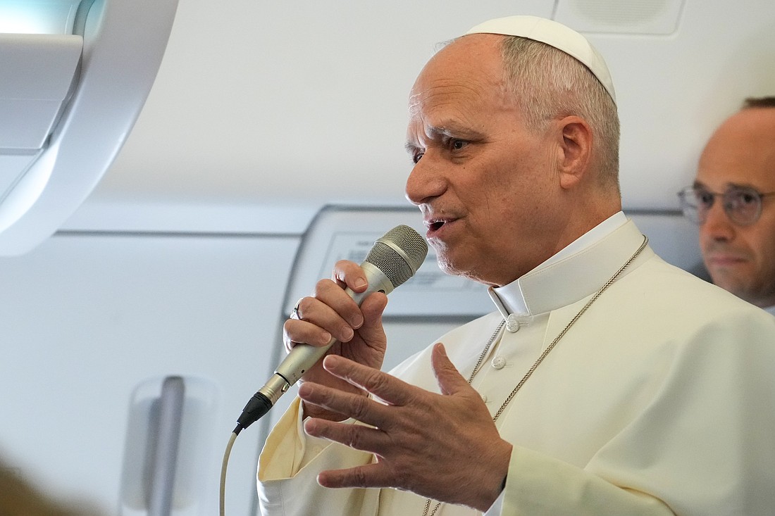 Pope Leo XIV speaks to reporters aboard the papal flight from Rome, Italy, to Algeria April 13, 2026. (CNS photo/Lola Gomez)