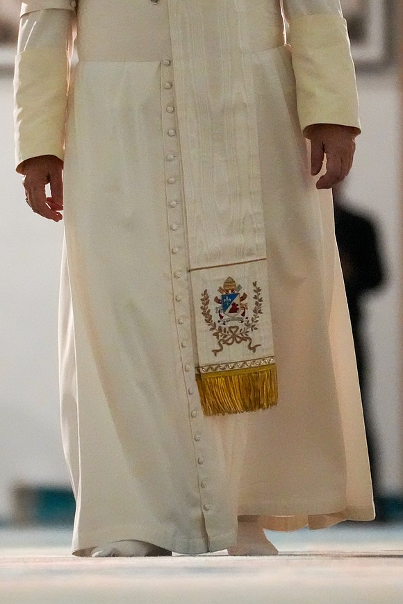 Pope Leo XIV walks without his shoes during a visit to the Great Mosque of Algiers in Algiers, Algeria, April 13, 2026. (CNS photo/Lola Gomez)