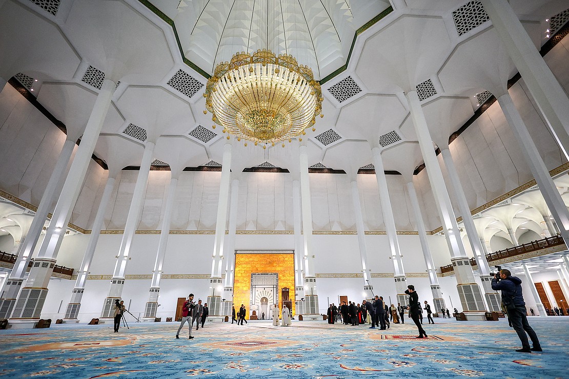 Pope Leo XIV walks with Mohammed Al-Mamoun Al-Qasimi Al-Hassani, rector of the Great Mosque of Algiers in Algiers, Algeria, April 13, 2026. The pontiff visited the mosque, one of the largest in the world, in a gesture aimed at reinforcing Christian-Muslim dialogue. (OSV News photo/Guglielmo Mangiapane, Reuters).
