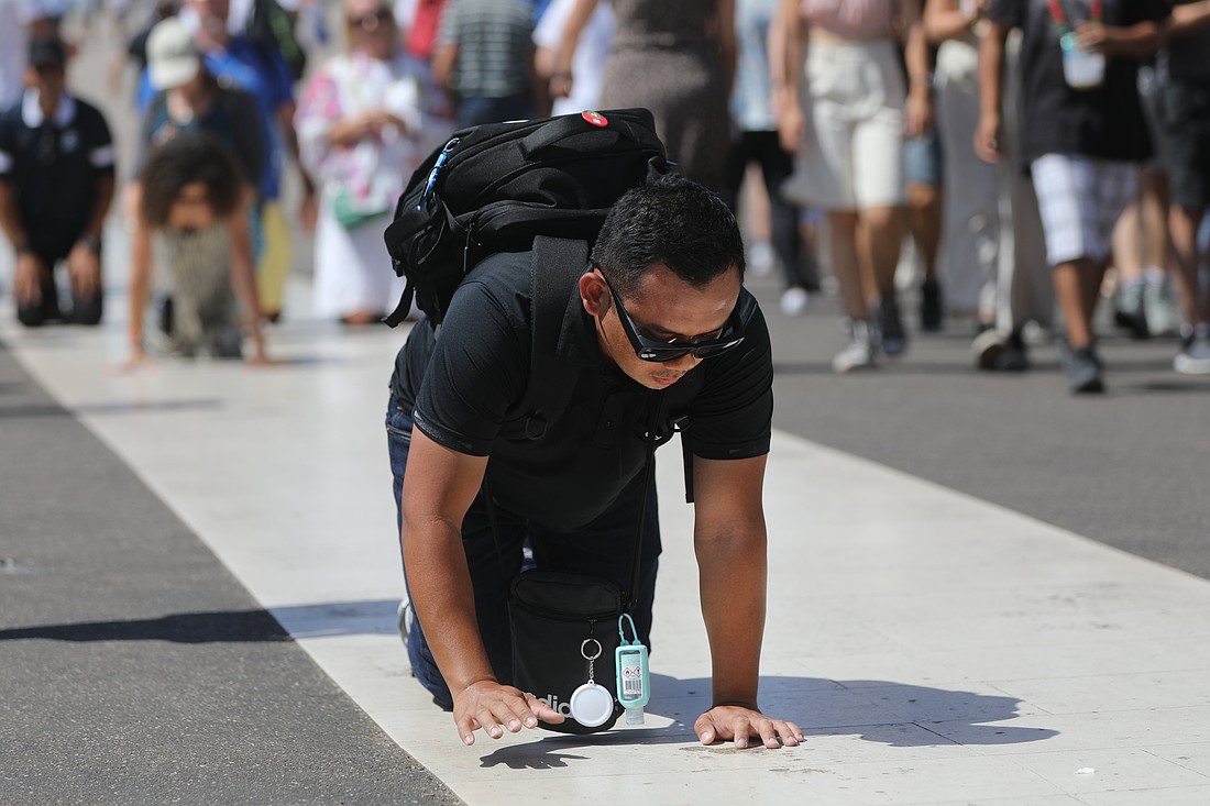 A pilgrim crawls on his hands and knees at the Shrine of Our Lady of Fatima in Portugal Aug. 7, 2023. (OSV News photo/Bob Roller)