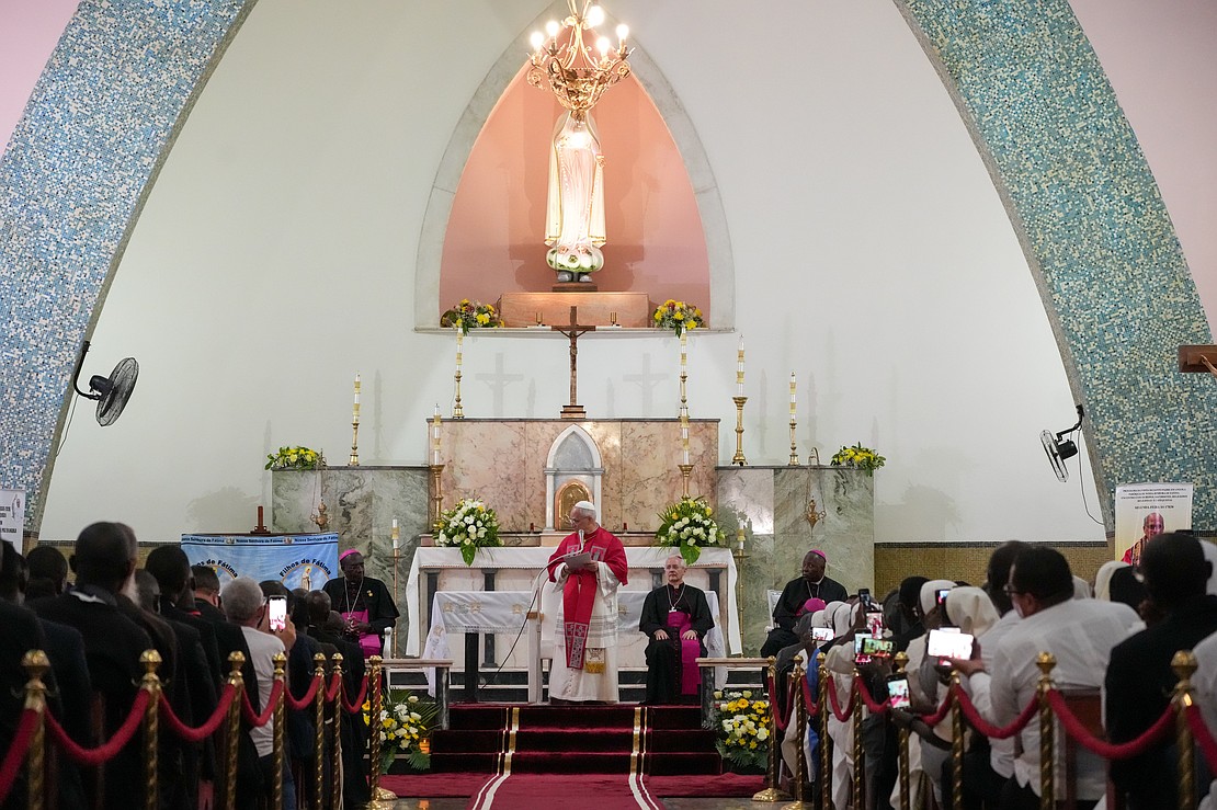 Pope Leo XIV speaks during a meeting with bishops, priests, religious and pastoral workers at Our Lady of Fatima Parish in Luanda, Angola, April 20, 2026. Archbishop José Manuel Imbamba, president of the bishops’ conference of Angola and São Tomé and Príncipe, joins the pope. (CNS photo/Lola Gomez)