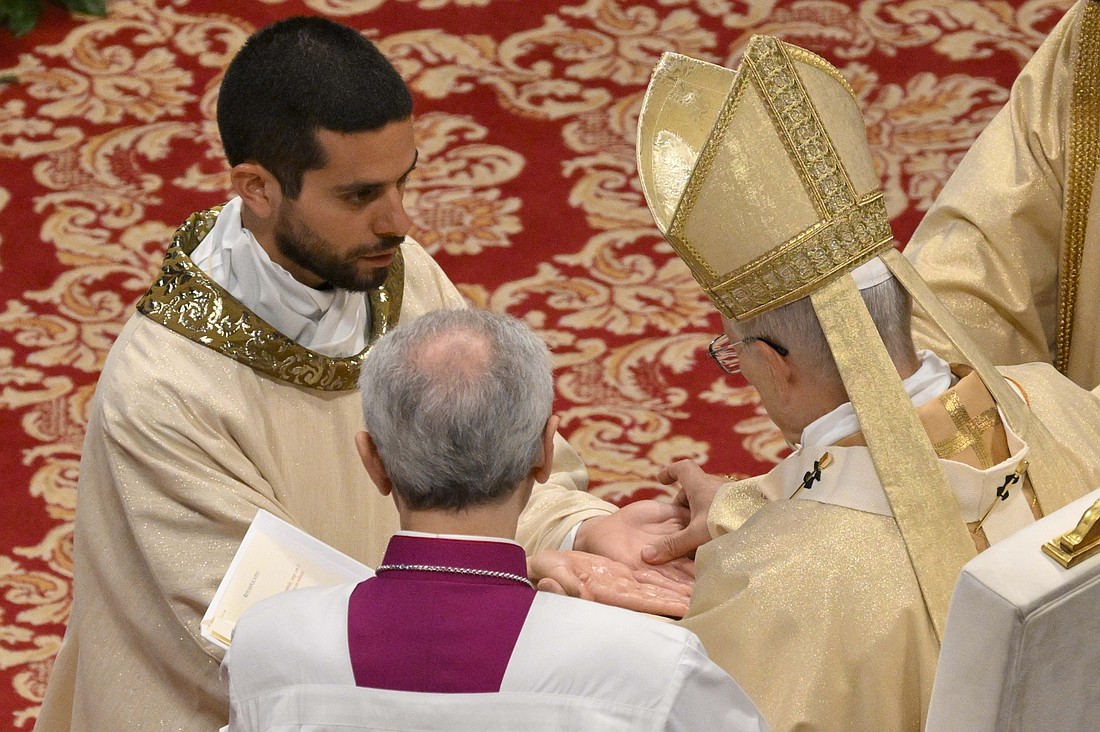 Pope Leo XIV anoints the hands of one of 10 priests as he celebrates their ordination Mass of 10 priests in St. Peter's Basilica at the Vatican April 26, 2026. Priests are called each day to leave the doors of the Church open to a "suffering humanity" in need and not "be an obstacle to those who wish to enter," Pope Leo told the deacons just before ordaining them to the priesthood. (OSV News photo/Franco Origlia, Random House/Elisabetta Trevisan, Vatican Media)