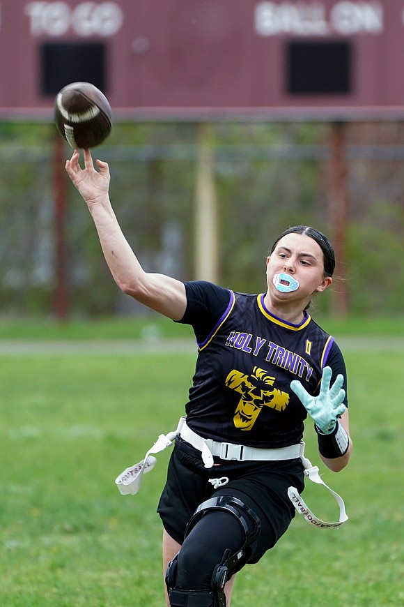 Holy Trinity quarterback Ella DiBacco passes the ball during the Pride's flag football game against Mohonasen on April 29 at Notre Dame-Bishop Gibbons School in Schenectady. Holy Trinity won 34-6. (Cindy Schultz photo for The Evangelist)