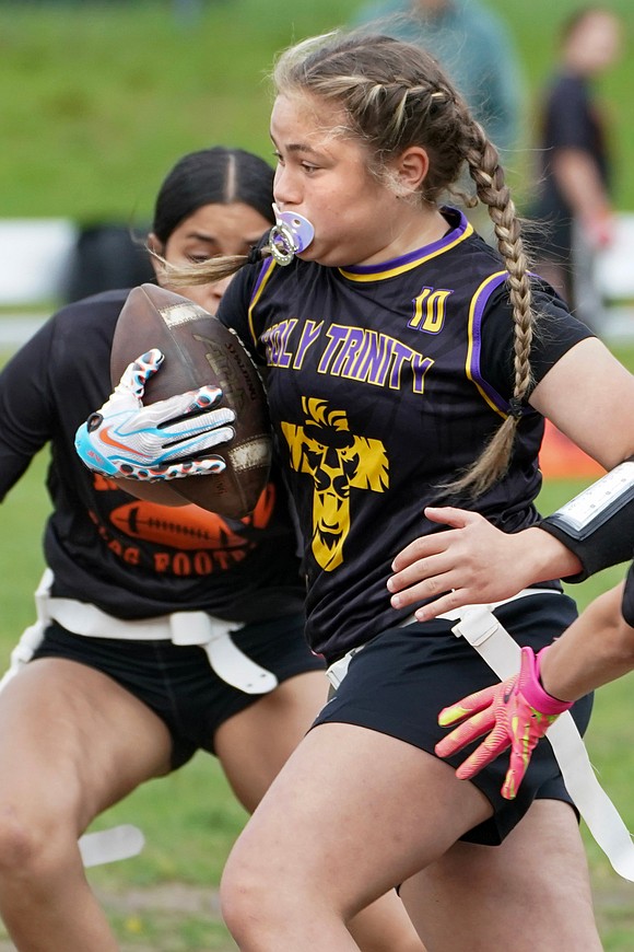 Holy Trinity’s Sophia Gundlach gains yards during their flag football game against Mohonasen on April 29 at Notre Dame-Bishop Gibbons School in Schenectady. Holy Trinity won 34-6. (Cindy Schultz photo for The Evangelist)