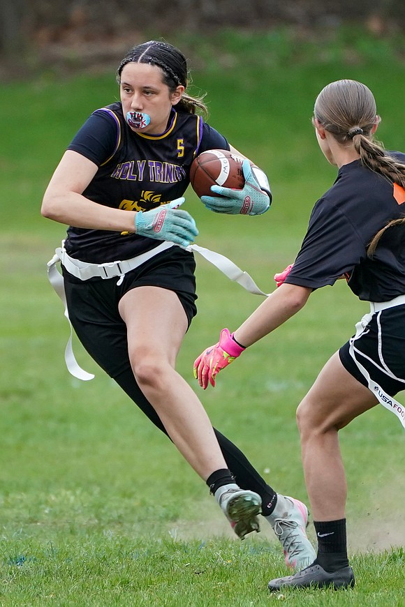 Holy Trinity’s Emma Sagendorf gains yards during their flag football game against Mohonasen on April 29 at Notre Dame-Bishop Gibbons School in Schenectady. Holy Trinity won 34-6. (Cindy Schultz photo for The Evangelist)