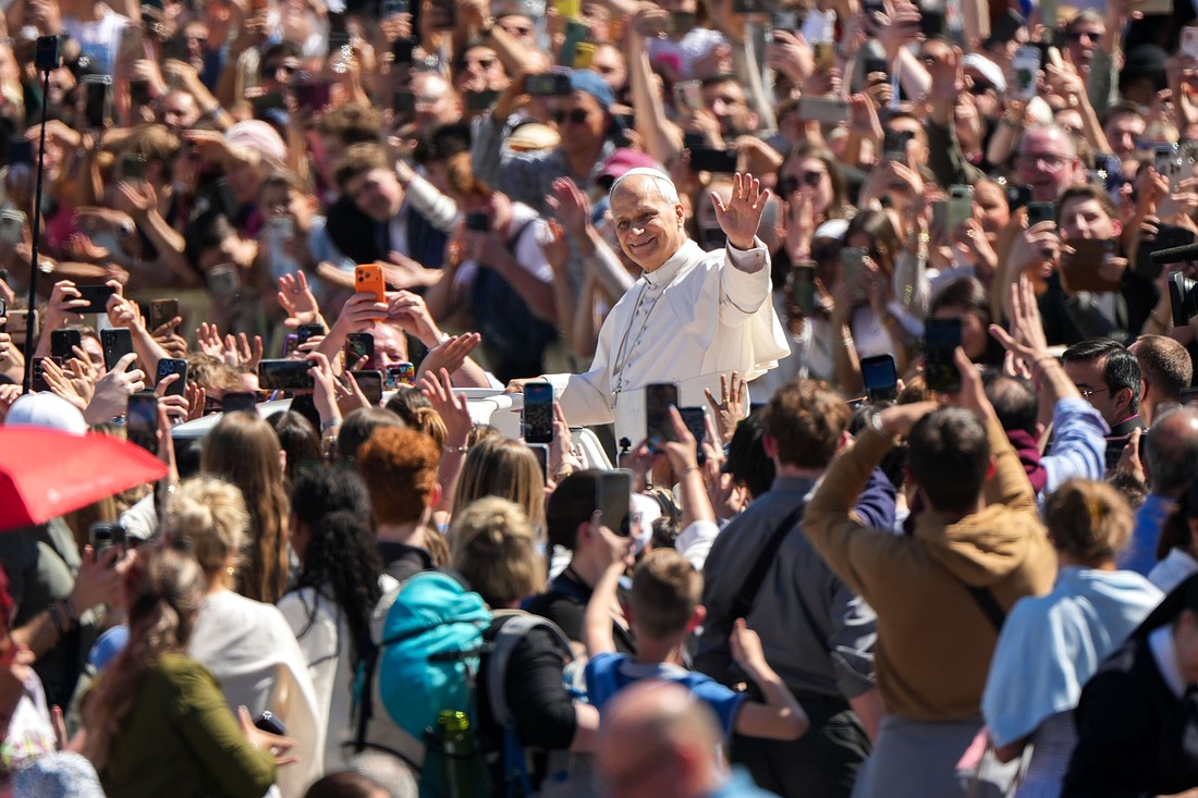 Pope Leo XIV greets people from the popemobile after appearing on the central balcony of St. Peter’s Basilica at the Vatican after Easter Mass April 5, 2026. (CNS photo/Lola Gomez)