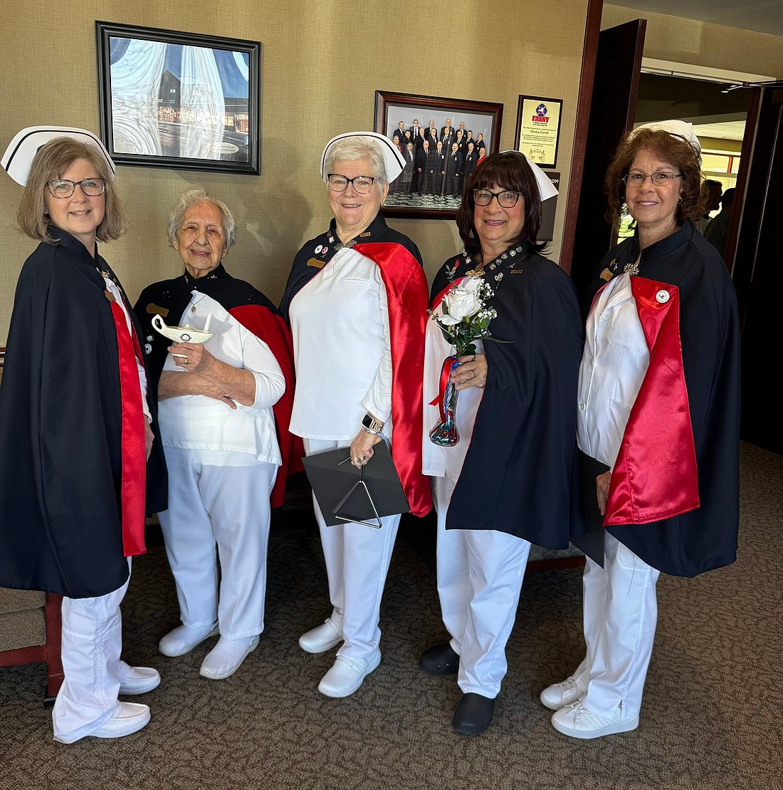 Esther Rappold (second from l.) and volunteers from the Capital Region Nurses Honor Guard traveled to the Firemen’s Home Chapel in Hudson on April 8 to honor Judy Smith, LPN, with the Nightingale Tribute. (Photo provided)