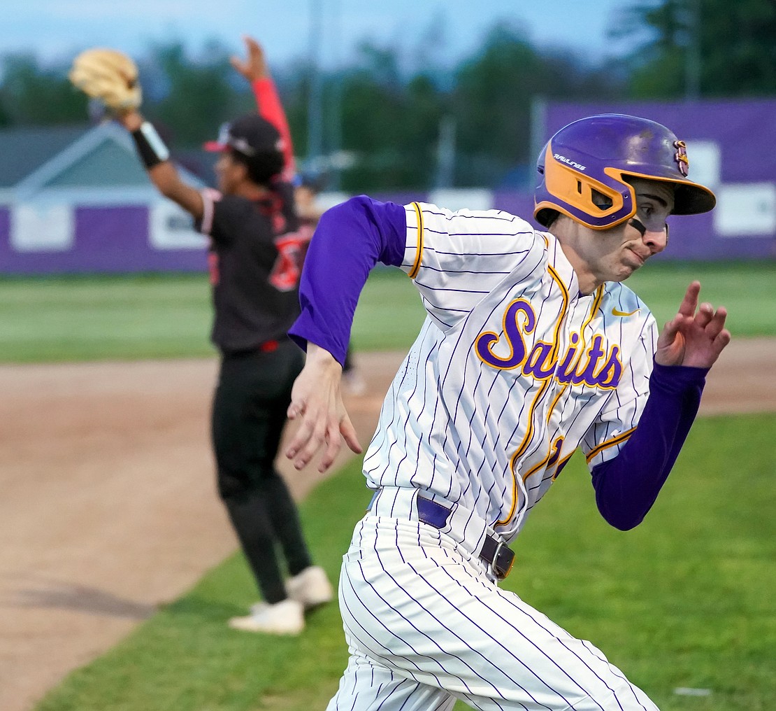 Spa Catholic’s Jason Pescetti rounds third and turns for home during the Saints' 12-0 win against Mechanicville on Friday, May 8, at Veteran’s Memorial Park in Saratoga Springs. (Cindy Schultz photo for The Evangelist)