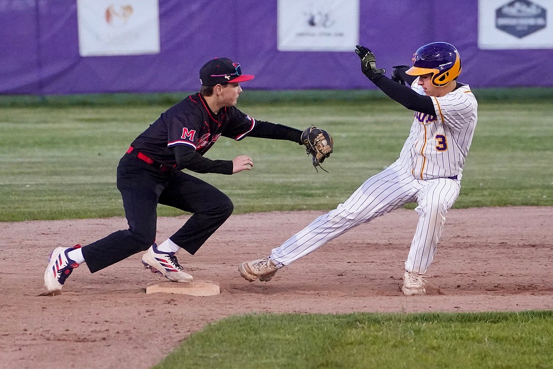 Spa Catholic’s Joey Lindner (r.) is safe as he slides into second under the glove of Mechanicville’s Travis Anello during their baseball game on Friday, May 8, at Veteran’s Memorial Park in Saratoga Springs. Saratoga Catholic Central School won 12-0. (Cindy Schultz photo for The Evangelist)