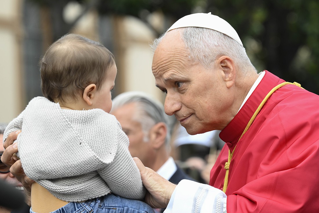 Pope Leo XIV greets a child as he arrives to celebrate Mass in Piazza Bartolo Longo in front of the Pontifical Shrine of the Blessed Virgin of the Rosary of Pompeii near Naples, Italy, May 8, 2026, on the first anniversary of his election as the first American pontiff. (OSV News photo/Mario Tomassetti, Vatican Media)