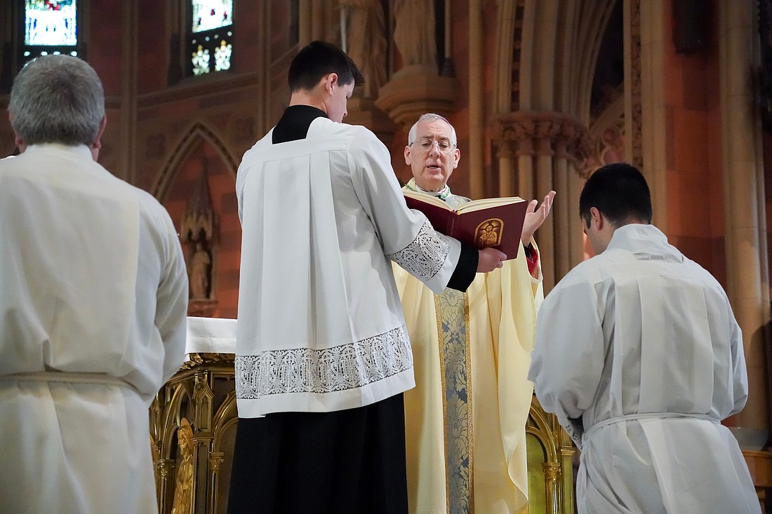 Bishop Mark O’Connell reads the Prayer of Ordination to candidates for deacon during the Mass of Ordination to the Priesthood and Diaconate on May 16 at the Cathedral of the Immaculate Conception in Albany. (Cindy Schultz photo for The Evangelist)