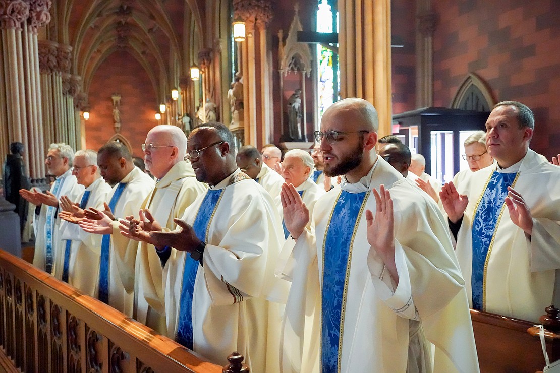 Priests take part in the Liturgy of the Eucharist during the Mass of Ordination to the Priesthood and Diaconate on May 16 at the Cathedral of the Immaculate Conception in Albany. (Cindy Schultz photo for The Evangelist)