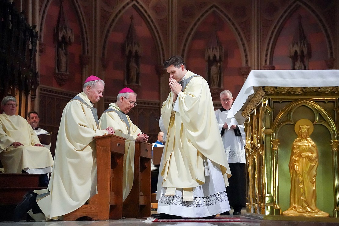 Newly ordained Father Alexander Turpin blesses Bishop Emeritus Edward B. Scharfenberger (l.) and Bishop Mark O’Connell during the Mass of Ordination to the Priesthood and Diaconate on May 16 at the Cathedral of the Immaculate Conception in Albany. (Cindy Schultz photo for The Evangelist)