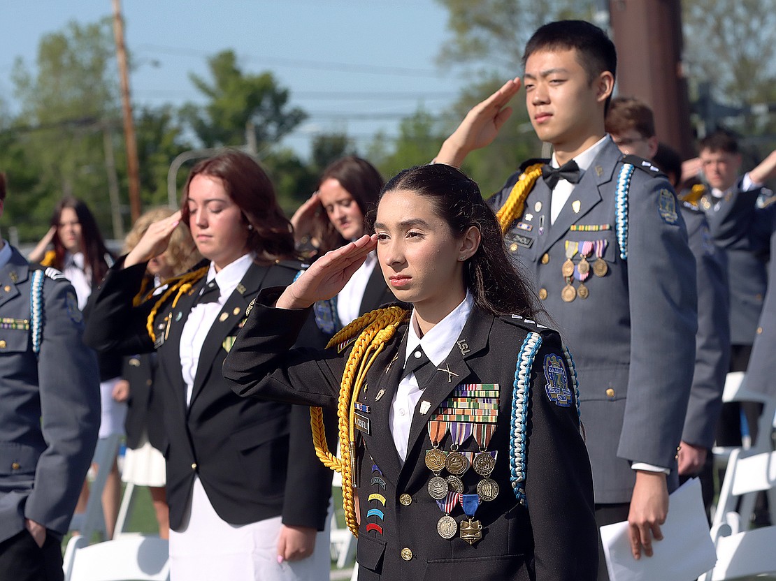 Alara Crisafulli, valedictorian and Cadet Colonel, leads the Class of 2026 as they salute during the National Anthem during La Salle Institute's 176th Commencement Ceremony on May 16. (Tom Killips photo).