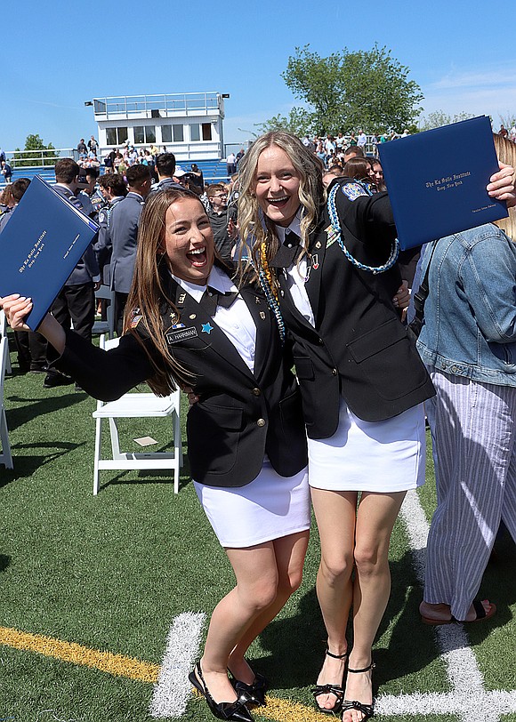 Abigail Harriman and Caroline Maloney celebrate after La Salle Institute's 176th Commencement Ceremony on May 16. (Tom Killips photo)