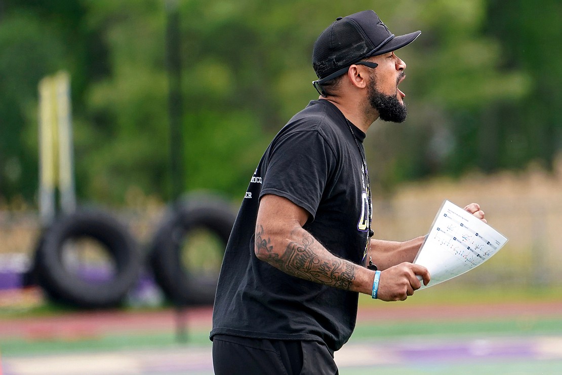 Holy Trinity coach EJ Hakala cheers on his team during the Pride's Section 2 Class C flag football final on May 22 at Christian Brothers Academy. (Cindy Schultz photo for The Evangelist)