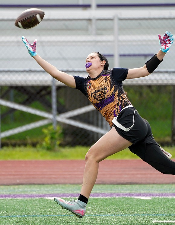 Holy Trinity’s Emma Sagendorf tries for a pass that’s just out of reach in the fourth quarter during the Pride's Section 2 Class C flag football final on May 22 at Christian Brothers Academy. (Cindy Schultz photo for The Evangelist)