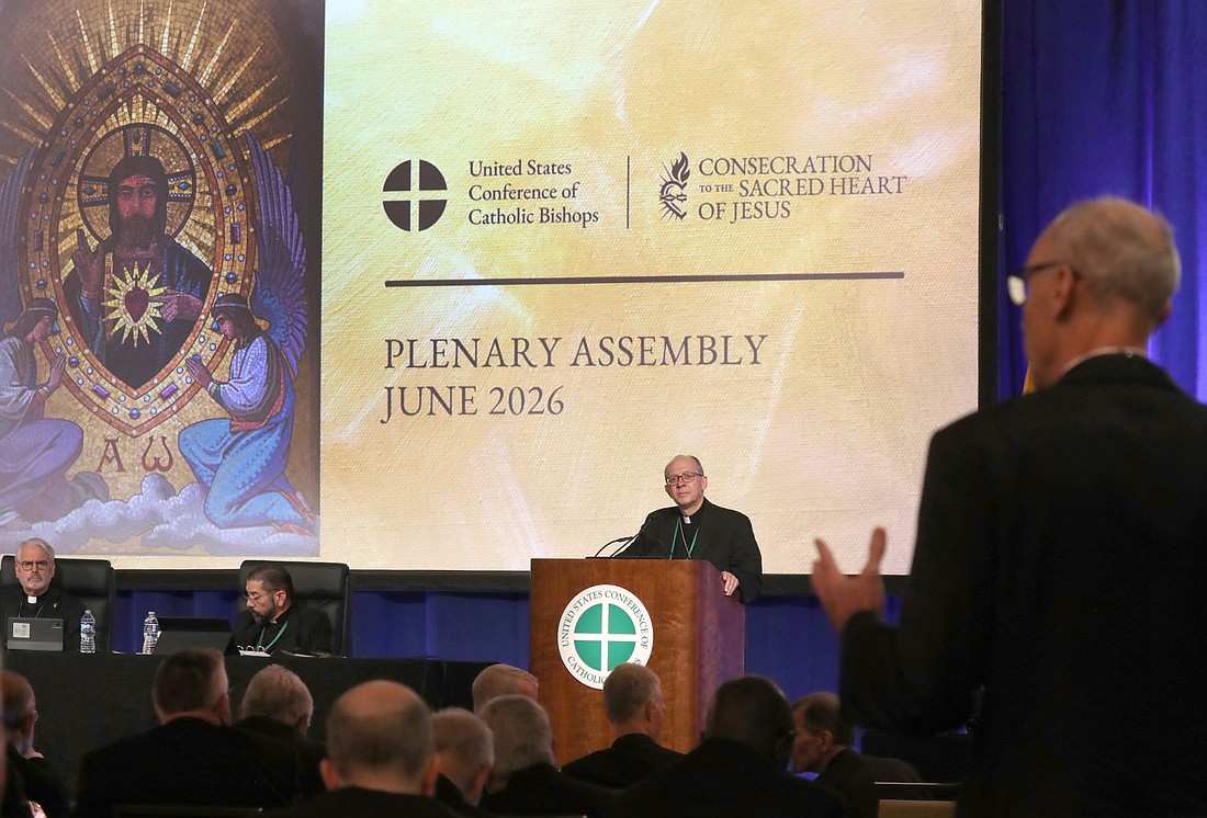 Bishop Barry C. Knestout of Richmond, Va., chairman of the bishops' Committee on the Protection of Children and Young People, listens as Baltimore Auxiliary Bishop Adam J. Parker asks a question during a June 11, 2026, session of the annual spring meeting of the U.S. Conference of Catholic Bishops in Orlando, Fla. (OSV News photo/Bob Roller)