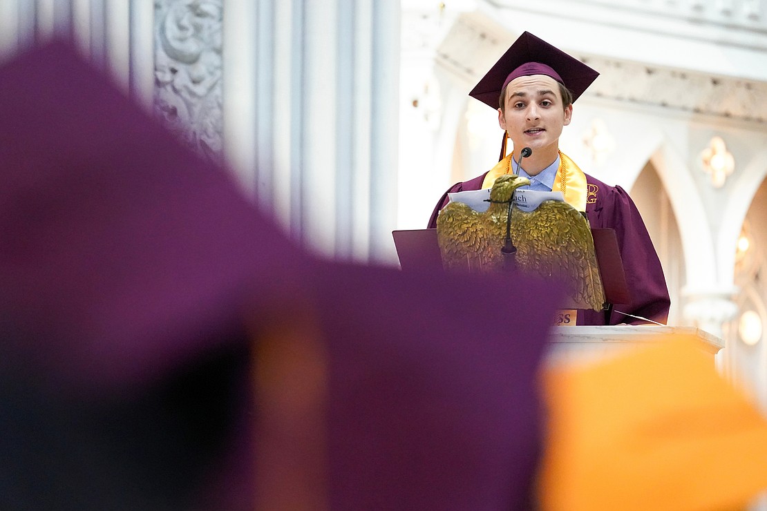 Graduate Owen Lavoie delivers the salutatorian address during the Notre Dame-Bishop Gibbons commencement exercises on June 6 at St. John the Evangelist in Schenectady. (Cindy Schultz photo for The Evangelist)