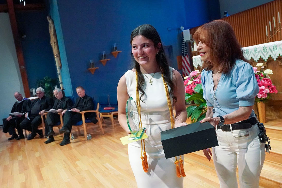Salutatorian Madelynn McDade receives the St. Ambrose Service Award during Catholic Central School's commencement exercises on June 27 at St. Ambrose Church in Latham. (Cindy Schultz photo for The Evangelist)
