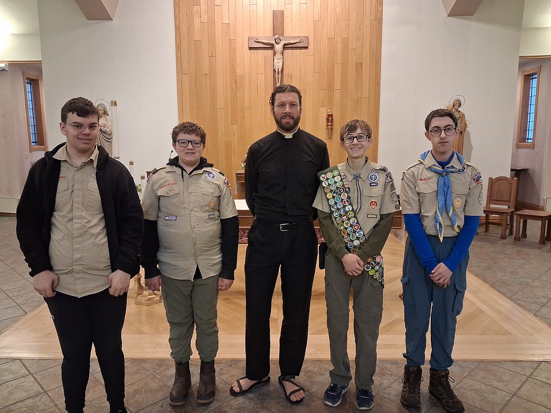 Scouts participated in a Faith Walk in Albany, where Scouts met with Father Daniel Quinn, former pastor of the Parish of Mater Christi. (Photo provided)