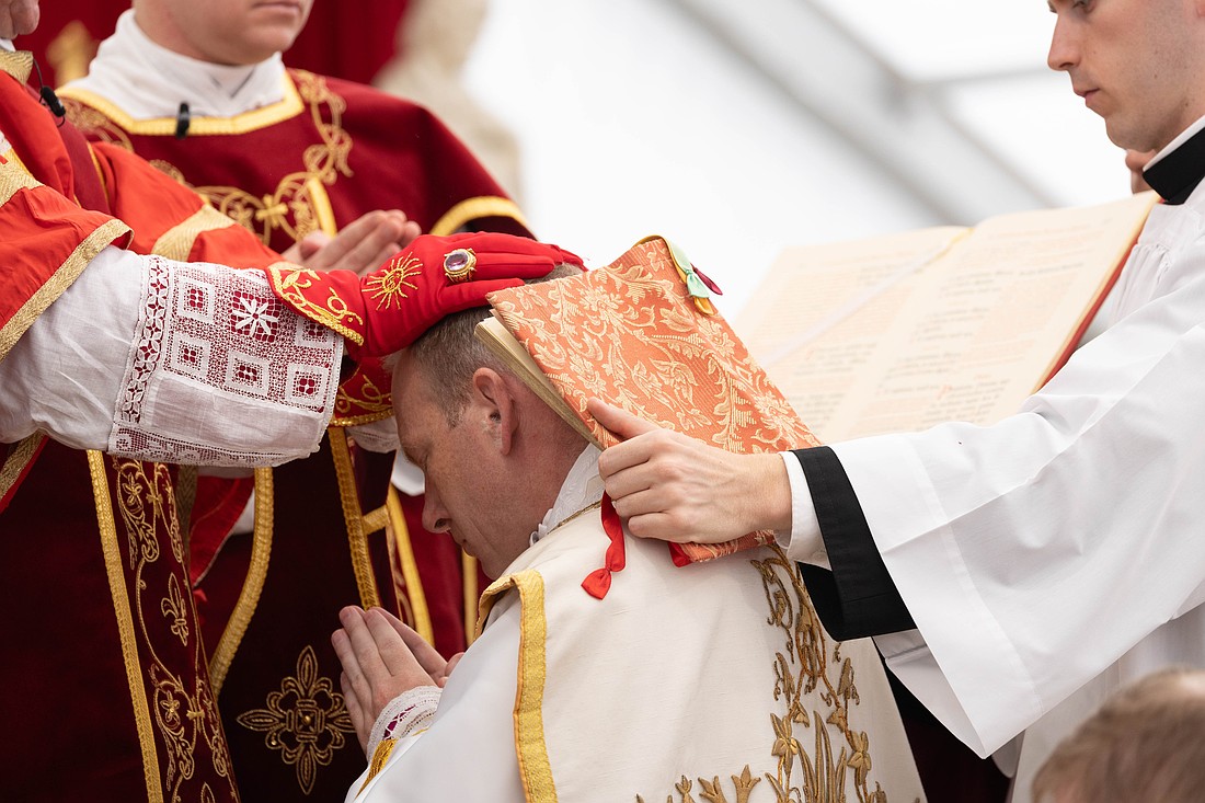 U.S. Father Michael Goldade bows with the Gospels on his shoulders as Bishop Alfonso de Galarreta lays his hands on his head during an episcopal ordination without papal approval for the Society of St. Pius X in Écône, Switzerland, July 1, 2026. The schismatic act of conferring episcopal consecration upon four priests without pontifical mandate and against the will of the pope incurred automatic excommunication for the prelates directly involved. (CNS photo/courtesy Society of St. Pius X)
