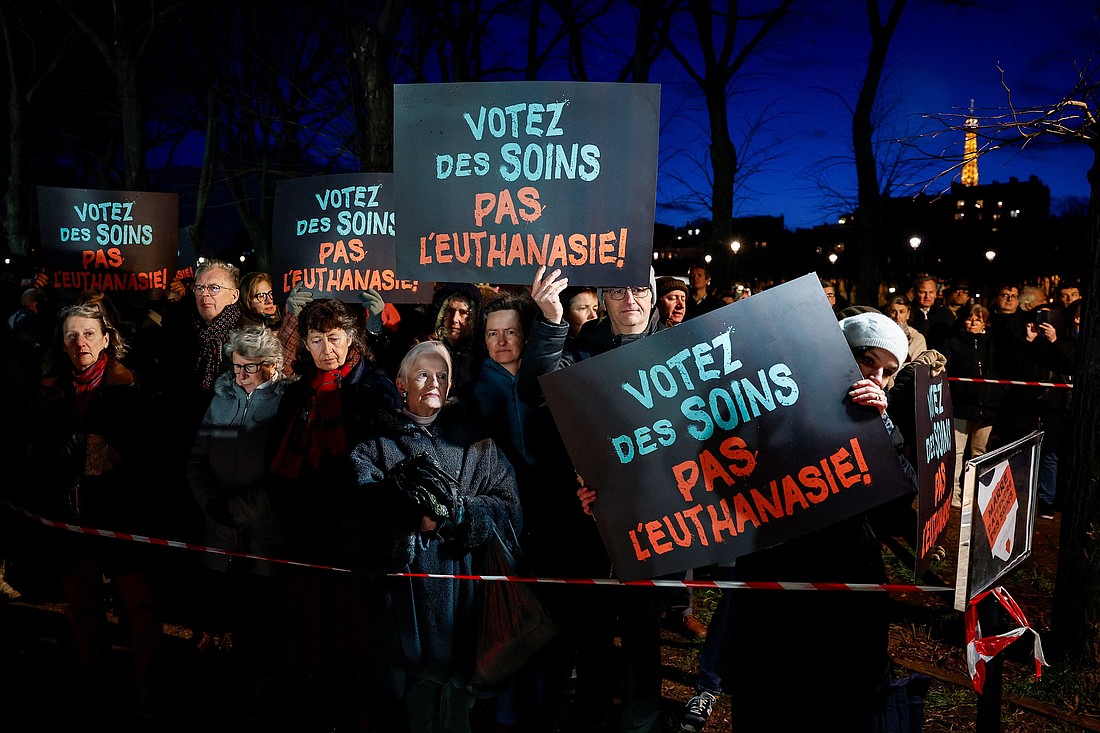 People hold placards reading "Vote for care. Not euthanasia" during a demonstration in Paris Feb. 16, 2026, as France debated a bill to legalize assisted dying. On July 15, French lawmakers voted decisively in favor of legalizing euthanasia and assisted suicide. (OSV News photo/Benoit Tessier, Reuters)