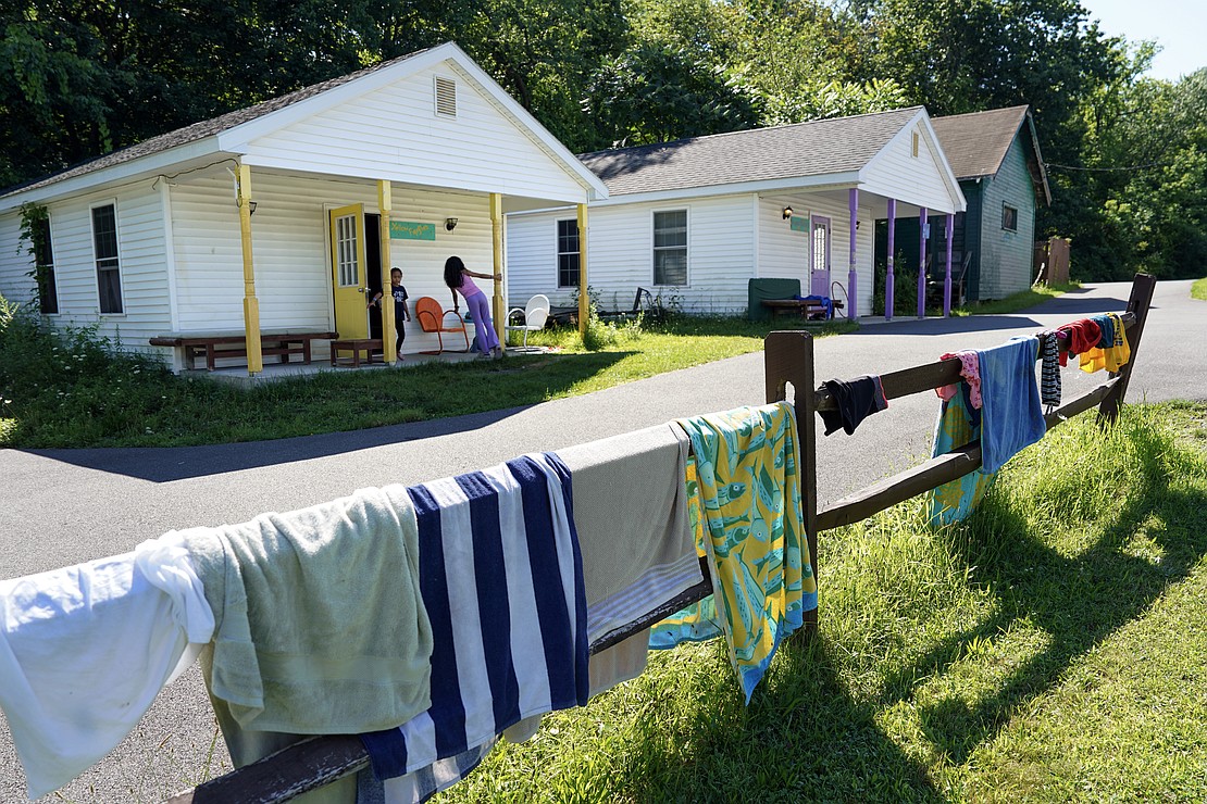 Towels from the morning’s kayak excursion dry in front of cabins on Aug. 4 at Camp Scully in Wynantskill. (Cindy Schultz photo for The Evangelist)