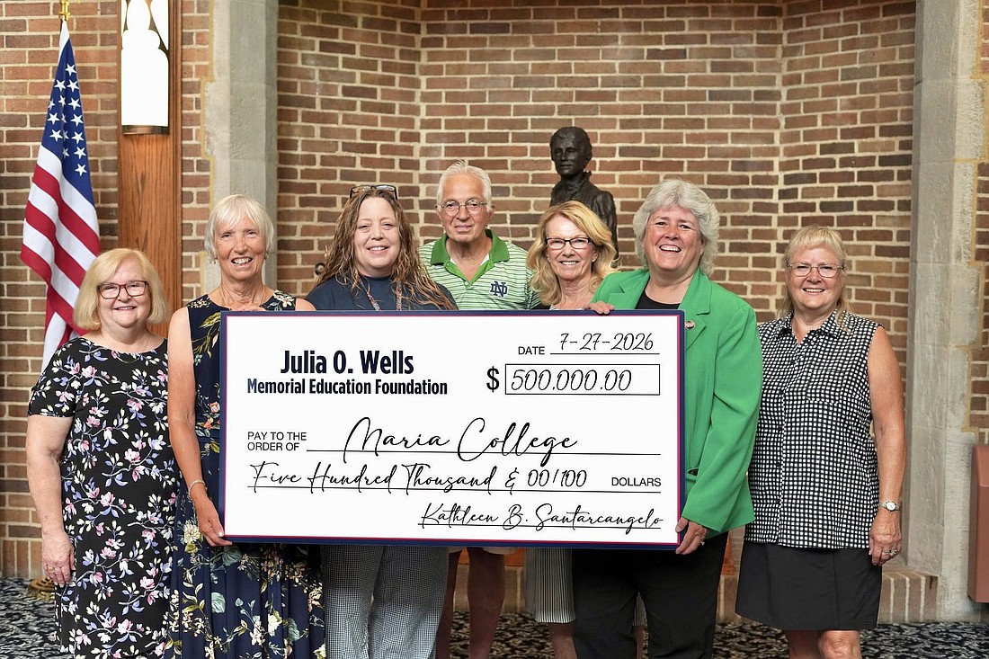 Maria College received a $500,000 gift from the Julia O. Wells Memorial Education Foundation Inc. on Aug. 5 to create an endowed scholarship fund supporting students in the college’s nursing programs. Shown during the check presentation are (from l.): Bonnie Bazyk, foundation trustee; Kathleen B. Santarcangelo, foundation president, Dr. Jessica McNally, Department Chair of Nursing, Andrea Lewis Siek School of Nursing; Ron Vero, foundation trustee; Christine Danielsen, foundation trustee; Dr. Lynn Ortale, president, Maria College; and Cheryl Fitzpatrick, foundation trustee. (Photo provided)