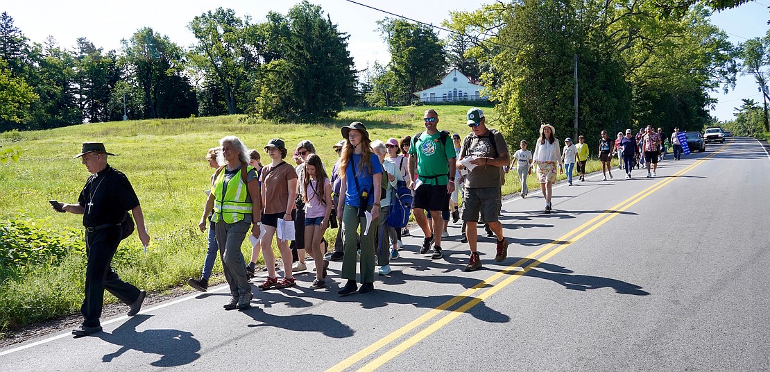 Bishop Mark O’Connell leads the Pilgrimage for Peace on Saturday, Aug. 22. The event started at the National Shrine of the North American Martyrs in Auriesville. Participants, praying the rosary and singing songs, walked six miles to the Saint Kateri Tekakwitha National Shrine and Historic Site in Fonda. (Cindy Schultz photo for The Evangelist)