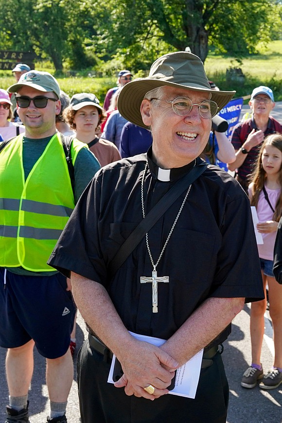 Bishop Mark O’Connell leads the Pilgrimage for Peace on Saturday, Aug. 22. The event started at the National Shrine of the North American Martyrs in Auriesville. Participants, praying the rosary and singing songs, walked six miles to the Saint Kateri Tekakwitha National Shrine and Historic Site in Fonda. (Cindy Schultz photo for The Evangelist)
