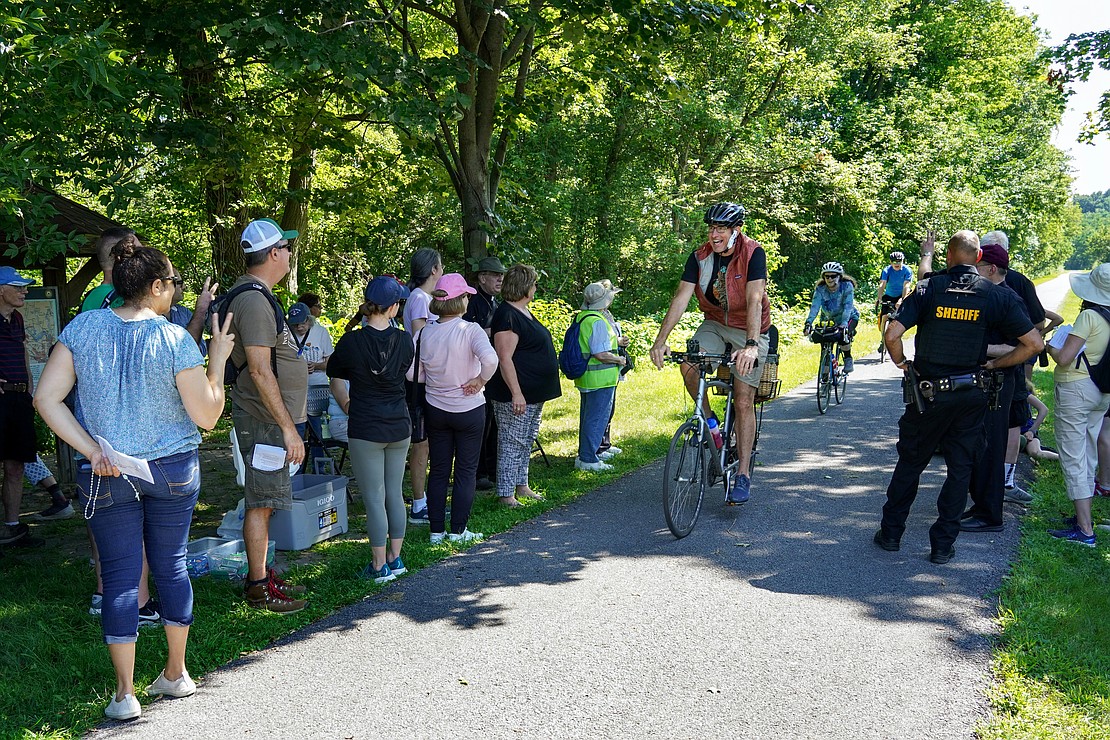 During a break, participants step aside to allow bicyclists to pass along the Erie Canalway Trail during the Pilgrimage for Peace on Saturday, Aug. 22. The event started at the National Shrine of the North American Martyrs in Auriesville. Participants, praying the rosary and singing songs, walked six miles to the Saint Kateri Tekakwitha National Shrine and Historic Site in Fonda. (Cindy Schultz photo for The Evangelist)