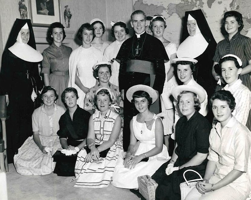 Archbishop Fulton J. Sheen is seen in an undated photo posing with women who worked at the Society for the Propagation of the Faith in New York City. (OSV News photo/Pontifical Mission Societies USA Archives)