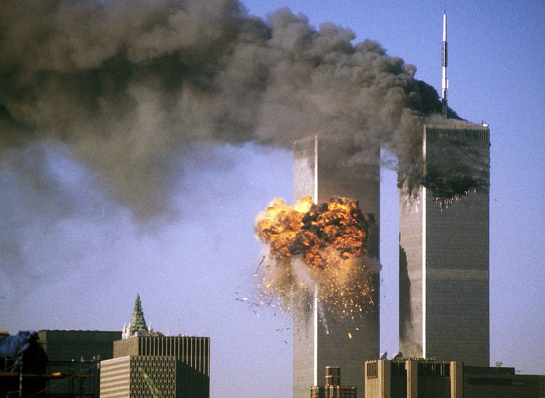 The south tower of the World Trade Center bursts into flames after being struck by United Airlines Flight 175 in New York in this Sept. 11, 2001, file photo. Twenty-five years after the 9/11 terrorism attacks that claimed the lives of nearly 3,000 people, Catholic family members who lost loved ones that day have credited their faith with getting through the losses. (OSV News photo/Sean Adair, Reuters)