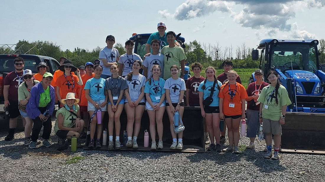 Diocesan youth, as part of the Service Action Learning Team (SALT) Service Weeks, facilitated by the Diocese of Albany’s Youth and Young Adult Ministry, are seen working at the Patroon Land Farm in Voorheesville, which is managed by the Regional Food Bank. (Photo provided)