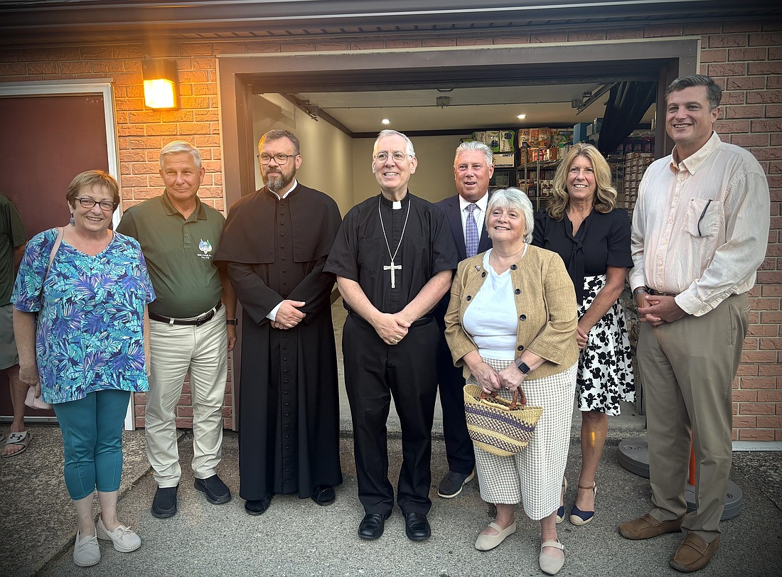 Bishop Mark O’Connell poses for a photo on Aug. 28 in front of the newly relocated St. Augustine Food Pantry along with Father Martin Kordel, parish priest of St. Augustine, Troy Mayor Carmella R. Mantello, (seventh from l.) New York State Sen. Jake Ashby (eighth from l.), New York State Assemblymember John T. McDonald III (fifth from l.), members of the Troy City Council and other representatives of the local community. Bishop Mark also celebrating Mass for the Feast of St. Augustine earlier in the evening at the church in Lansingburgh. After the Mass and the blessing of the pantry by Bishop Mark, parishioners enjoyed the annual parish picnic. (Photos provided)