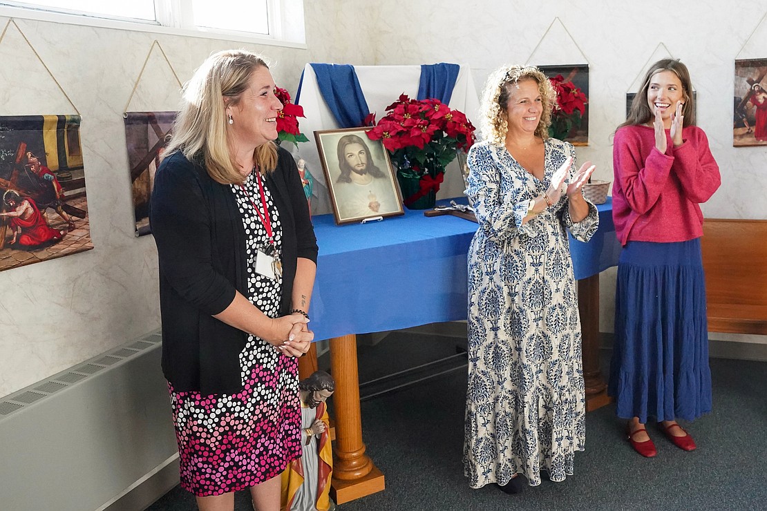 Principal Lindsay Morris (l.) shares what she’s grateful for as the staff gathers for a morning prayer before students arrive on Sept. 10 at St. Mary’s School in Ballston Spa. (Cindy Schultz photo for The Evangelist)