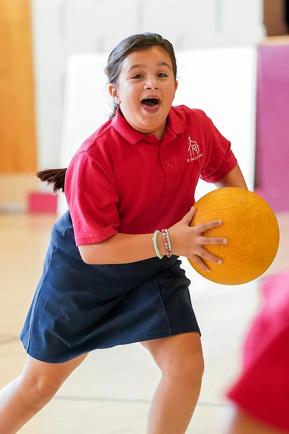 Milani Manna plays in the gymnasium before the school day starts on Sept. 10 at St. Mary’s School in Ballston Spa. (Cindy Schultz photo for The Evangelist)