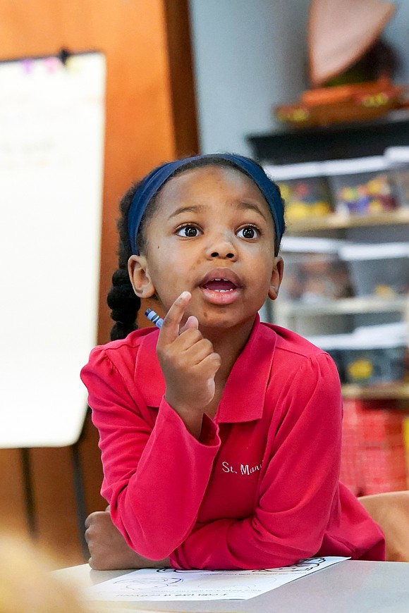 Kindergartner Catherine Bee Somerville asks a questions in class on Sept. 10 at St. Mary’s School in Ballston Spa. (Cindy Schultz photo for The Evangelist)