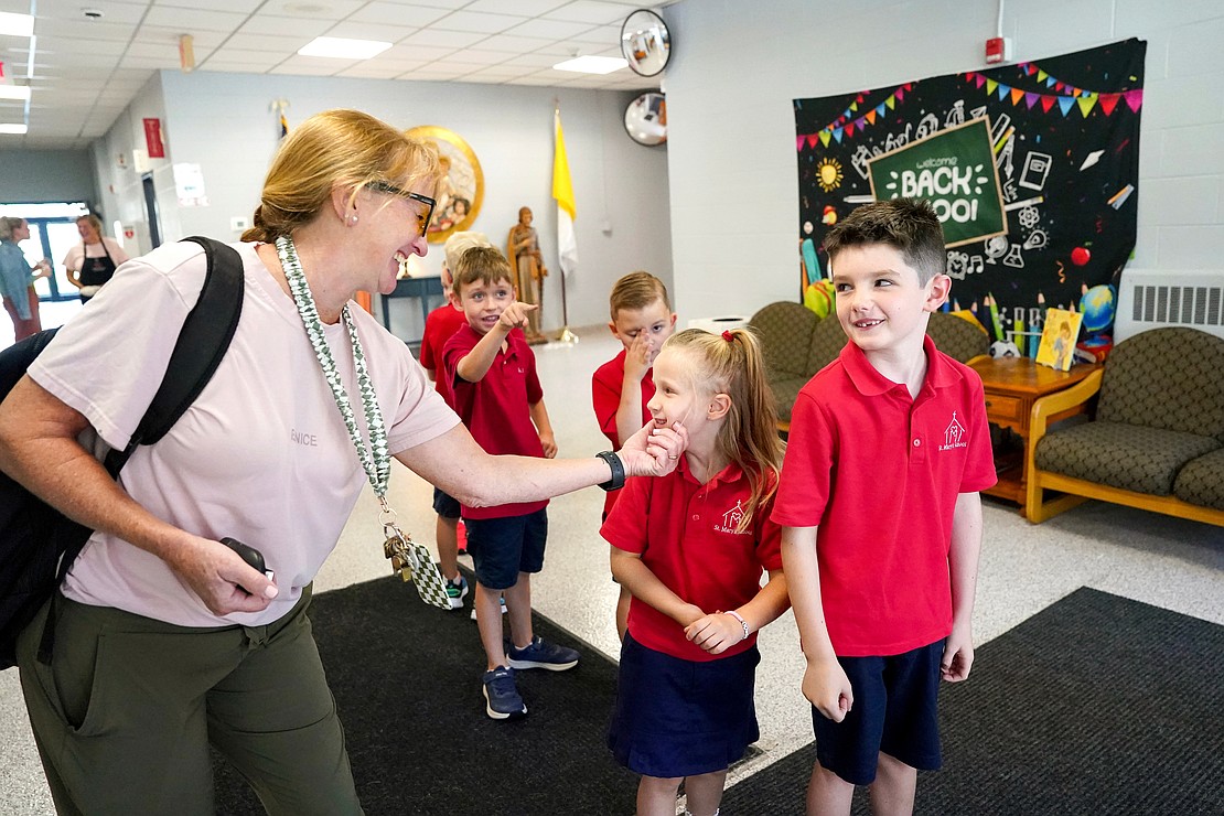 Physical-education teacher Debbie Merritt teases students as they line up for recess on the playground on Sept. 10 at St. Mary’s School in Ballston Spa. (Cindy Schultz photo for The Evangelist)