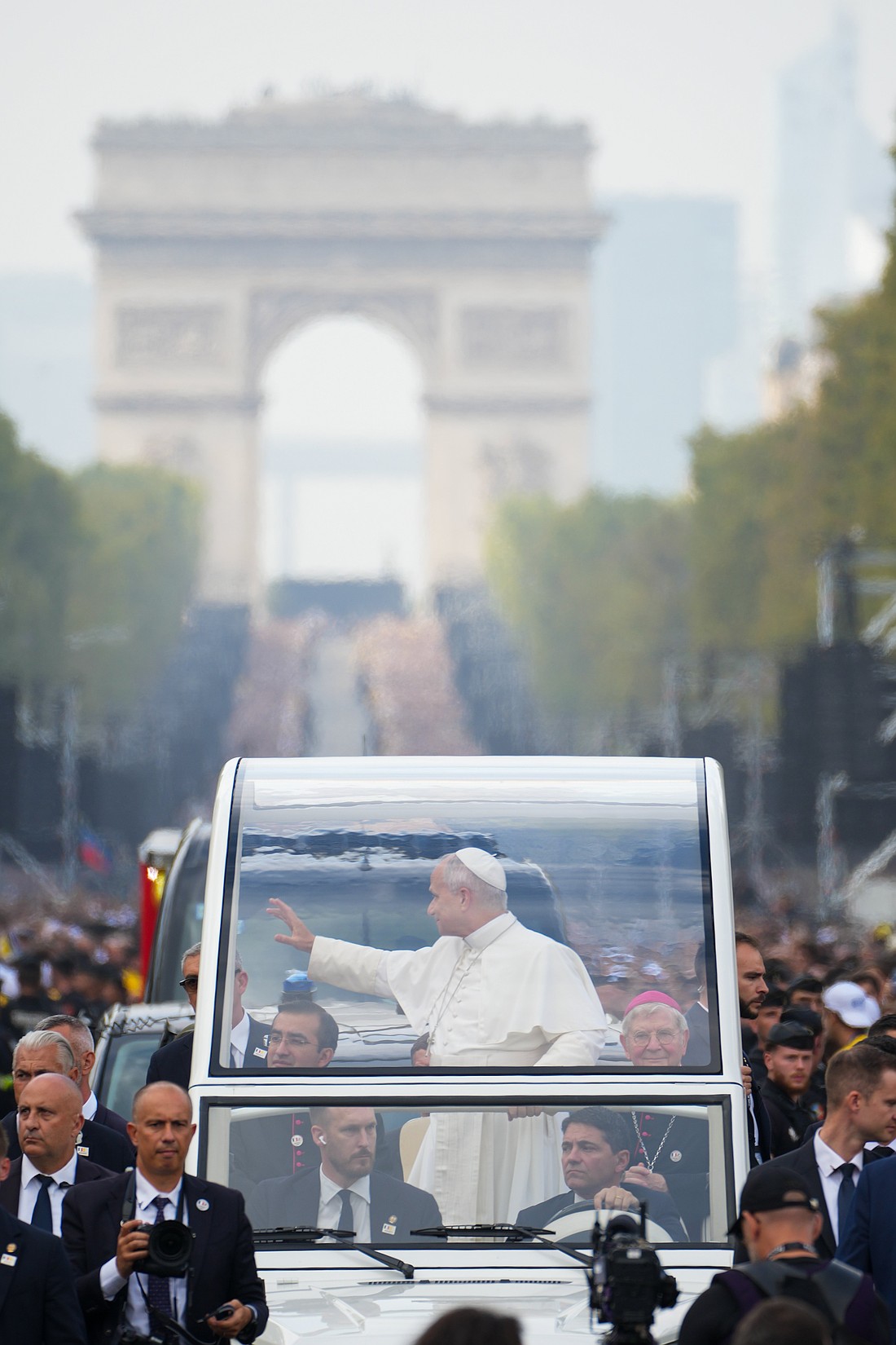 Pope Leo XIV rides in the popemobile from Place Charles-de-Gaulle to Place de la Concorde in Paris Sept. 26, 2026, before celebrating Mass during his apostolic journey to France. The Arc de Triomphe is in the background. (CNS photo/Lola Gomez)