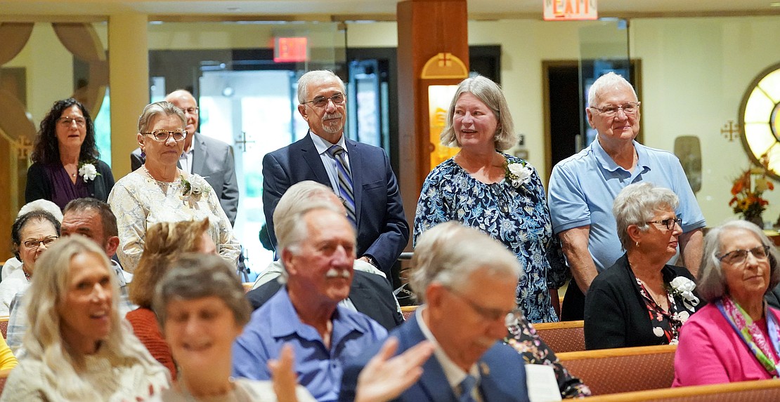 Couples stand to receive recognition for their years of marriage during the 54th Annual Diocesan Marriage Jubilee Celebration on Sunday, Sept. 27, at Christ Our Light Catholic Church in Loudonville. (Cindy Schultz photo for The Evangelist)