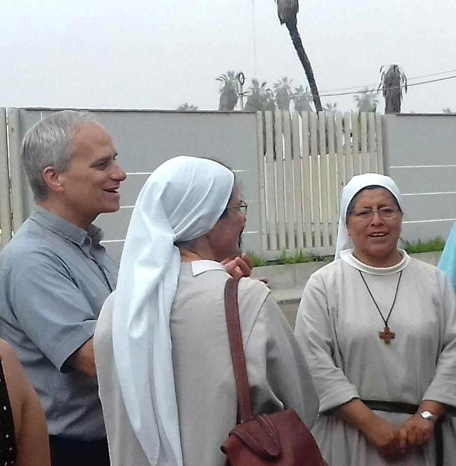 The future Pope Leo XIV visits with Augustinian sisters in Peru in this undated photo. As an Augustinian priest, then-Father Robert F. Prevost spent many years as a missionary in Peru and also served as bishop of that country's Diocese of Chiclayo. (OSV News photo