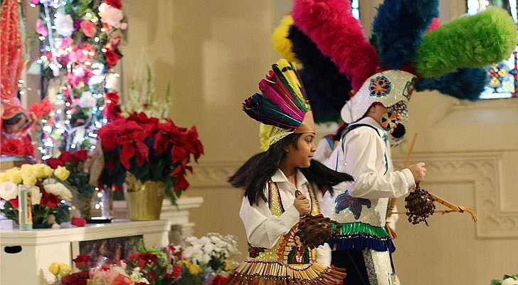 The Shrine Church of Our Lady of the Americas in Albany celebrated a Mass honoring Our Lady of Guadalupe with Bishop Edward B. Scharfenberger on Sunday, Dec. 15. According to CNS, “Our Lady of Guadalupe appeared to St. Juan Diego on Tepeyac Hill near Mexico City on Dec. 9 and Dec. 12, 1531, saying she wanted a church built in her honor on that hill. The bishop, who originally ignored Juan Diego, asked for a sign from her and Mary produced enough roses in December to fill his tilma, a type of outer garment. When he emptied the cloak and the roses fell in front of the bishop, he found that she had left her image on the cloak, which remains today in the Basilica of Our Lady of Guadalupe in Mexico City.” The feast day of Our Lady of Guadalupe is Dec. 12.   Aztec-attired dancers pay tribute to the Virgin Mary of Guadalupe.  Photos by Thomas Killips