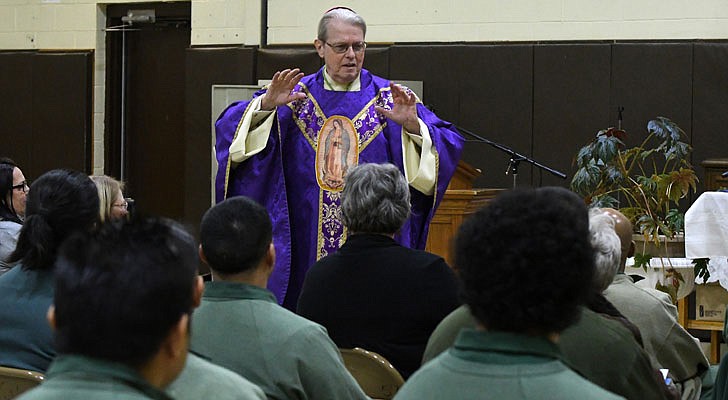 Bishop Edward B. Scharfenberger celebrated a special Christmas Mass for inmates at the Washington Correctional Facility in Comstock on Thursday, Dec. 19. Deacon Miguel Fabian, the facility’s chaplain, Father Rendell Torres and Deacon Ryan McNulty resided over the Mass, which was held in the facility’s gymnasium and attended by 33 inmates.  Bishop Scharfenberger delivers his homily.  Michael P. Farrell photos