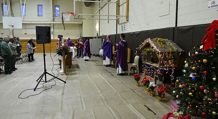 Bishop Edward B. Scharfenberger celebrated a special Christmas Mass for inmates at the Washington Correctional Facility in Comstock on Thursday, Dec. 19. Deacon Miguel Fabian, the facility’s chaplain, Father Rendell Torres and Deacon Ryan McNulty resided over the Mass, which was held in the facility’s gymnasium and attended by 33 inmates.   Christmas decorations adorn the gym, which held the Mass at Washington Correctional Facility in Comstock.  Michael P. Farrell photos