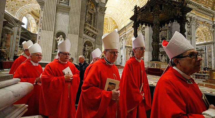 Bishop Edward B. Scharfenberger, center, and other U.S. bishops from the state of New York arrive to concelebrate Mass in the crypt of St. Peter's Basilica at the Vatican Nov. 14, 2019. The bishops were making their "ad limina" visits to the Vatican to report on the status of their dioceses to the pope and Vatican officials.   CNS photo/Paul Haring 