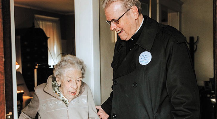 Bishop chats with Arleen Costa during a ride-along for Meals on Wheels in Schenectady.   Kate Costello photo